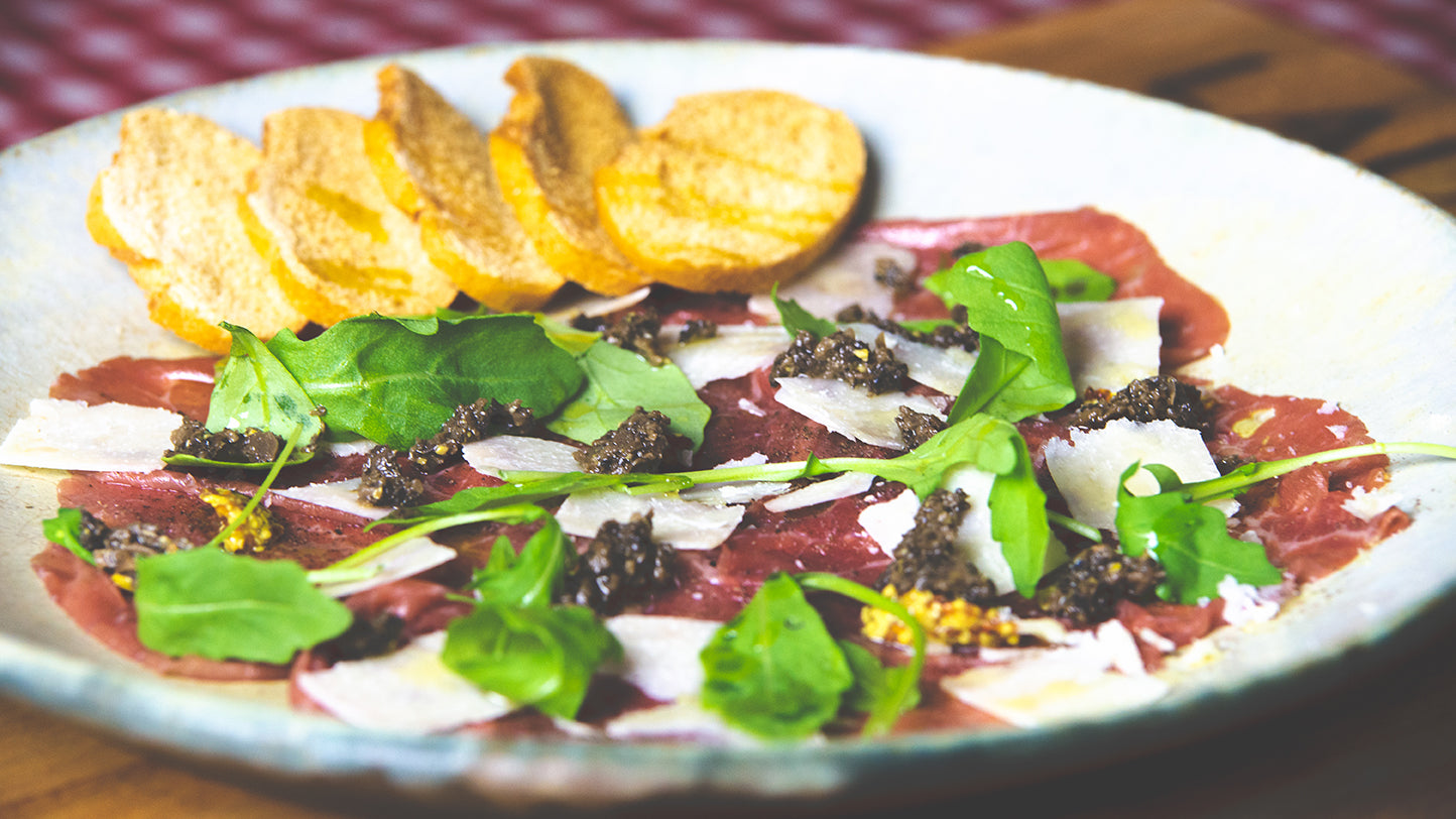 Veal carpaccio with parmesan and tartufata truffle sauce